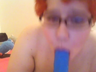 Inexperienced ginger-haired poses and milks with fucktoys