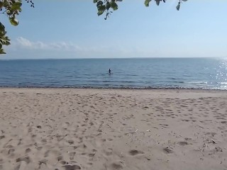 'what the hell is he doing? Caught a bombshell on a public beach'